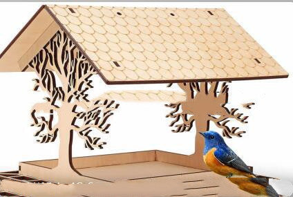 Wooden birdhouse with a bluebird perched on it