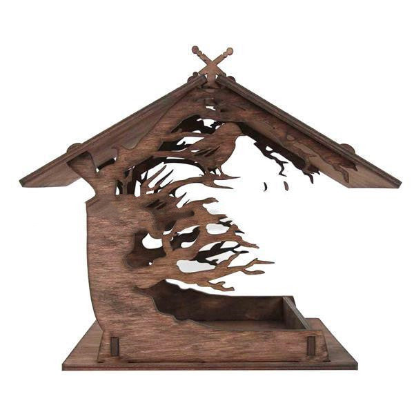 Wooden bird feeder with tree and bird design on a white background